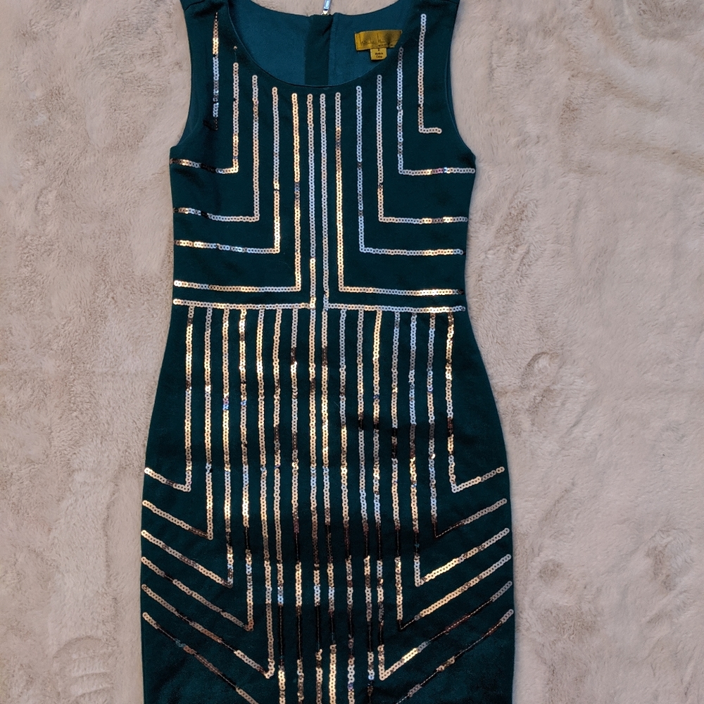 Dark green mini dress with gold sequins.
